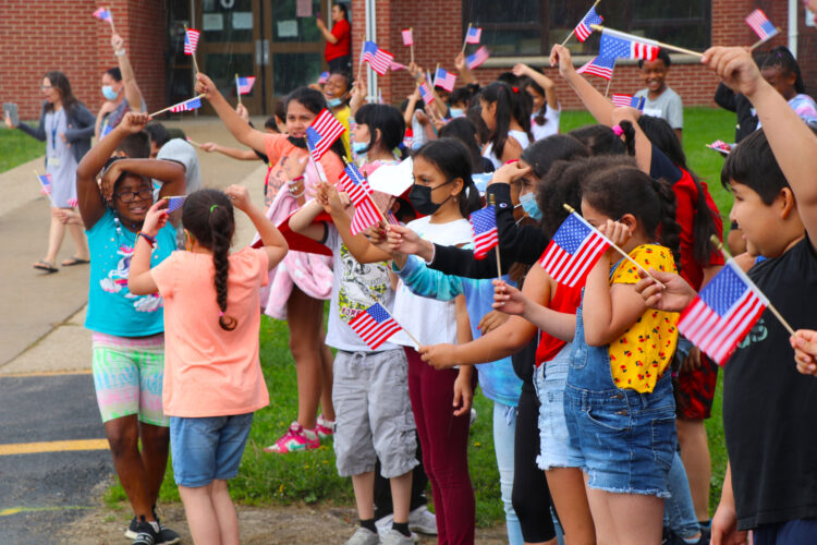 Veterans from Operation Welcome You Home conducted a motorcycle rally through the parking lot of Allen Elementary, with police escort, where students waved and cheered on